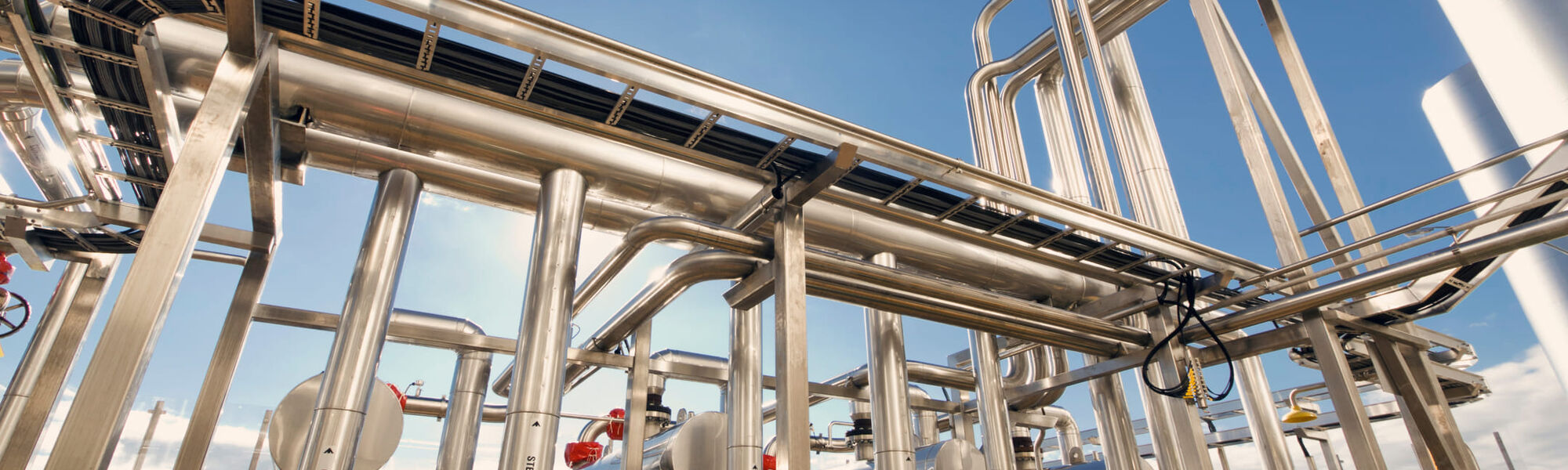 Industrial pipework and valves inside a processing plant